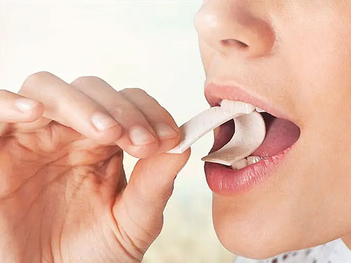Would chewing gum have the same effect as brushing teeth?